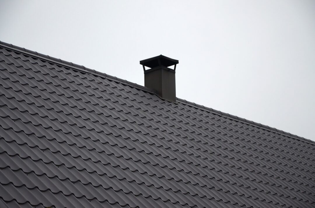 Modern brown corrugated metal roof protected by SA Rubber Proof